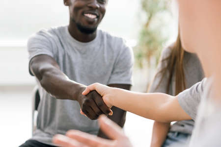 close up. friendly handshake fellow students during the meetingの写真素材