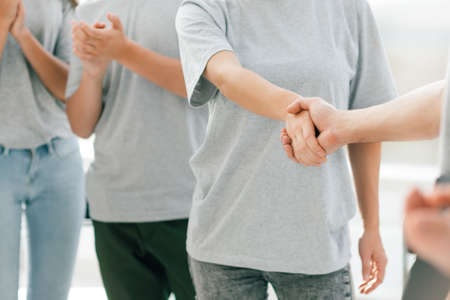 young forum participants shaking hands with each other