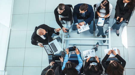 top view. business team using a laptop to analyze financial data