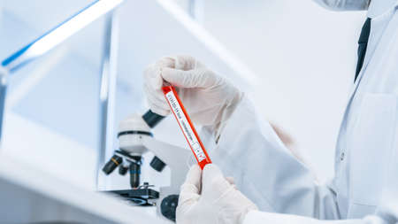 close up. laboratory employee sitting at the laboratory tableの写真素材