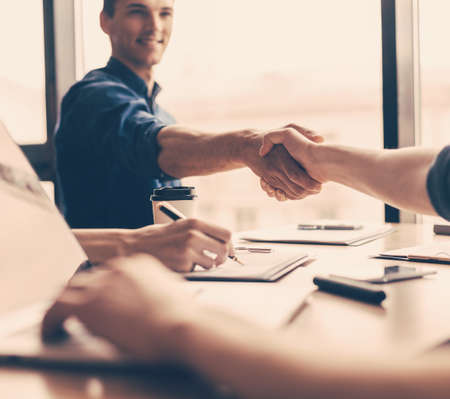 close up. young business people entering into a new contract.の写真素材