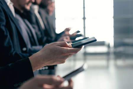 close up . image of a group of young business people with smartphonesの写真素材