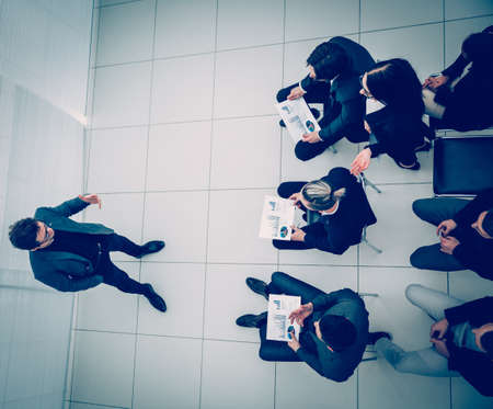 working group discussing a new strategy at an office meeting.の写真素材