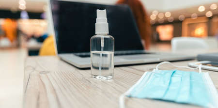 close up. spray and protective mask on the office Deskの写真素材