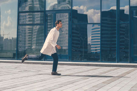 in full growth. a concerned paramedic runs to help.の写真素材