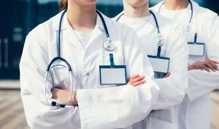 close up. group of medics with blank badges standing in a row.の写真素材