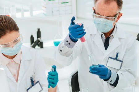 close up. researchers work with tests in the laboratory.