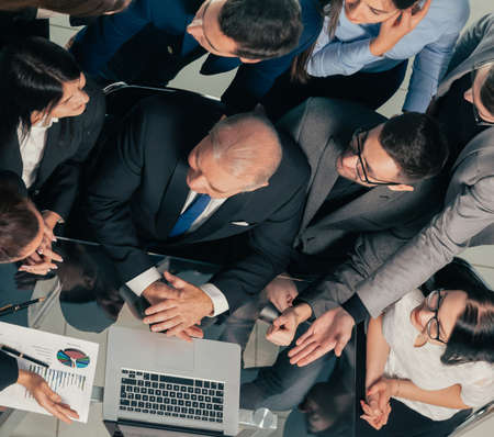 top view. business team applauding in the workplace.の写真素材