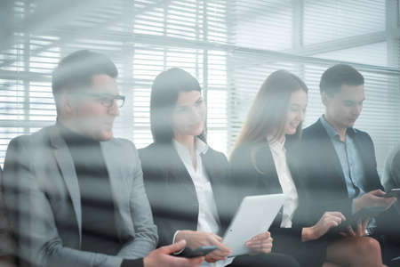group of candidates filling out an interview form.