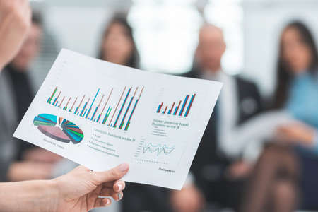 close up. a document with a financial schedule in the hands of a business woman