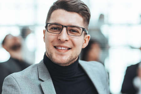 confident business man standing in the office