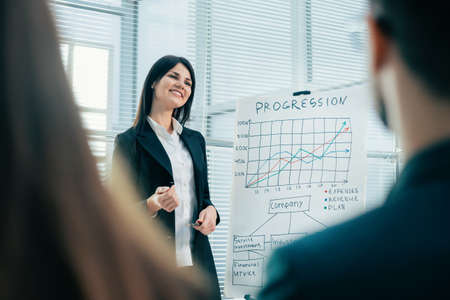 financial Manager making a report at a meeting with the working group.の写真素材