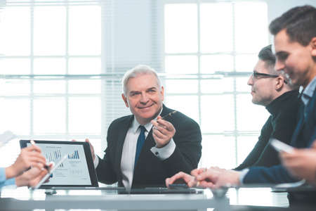 working group discussing the financial report at the working meetingの写真素材