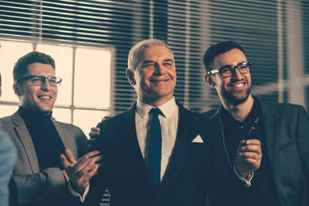 group of successful entrepreneurs standing in the officeの写真素材
