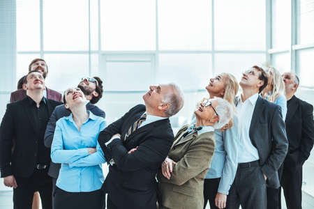 large group of diverse business people looking up.