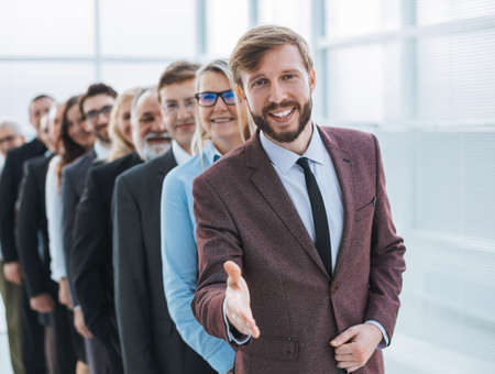 friendly businessman meeting his partners with a handshake.の写真素材