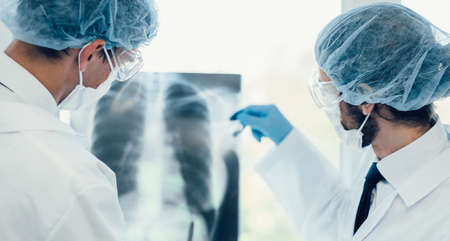 close up. medical colleagues discussing an x-ray of the lungs .