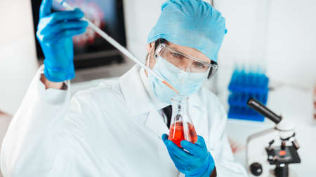 close up. scientist conducts research in the laboratory.の写真素材