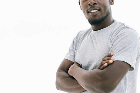 confident young man in a white t-shirt. isolated on white