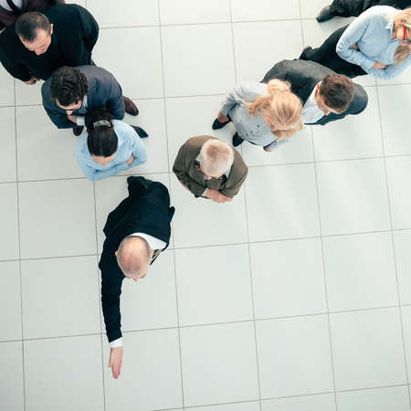 top view. a confident businessman leading his team forward.