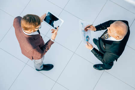 top view. business colleagues discussing the financial schedule.の写真素材