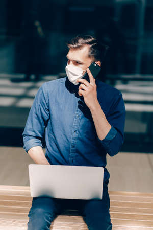 close up. young man talking on a mobile phone.の写真素材