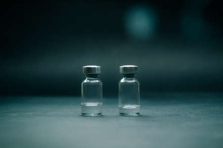 close up. two medical ampoules on a dark background.の写真素材