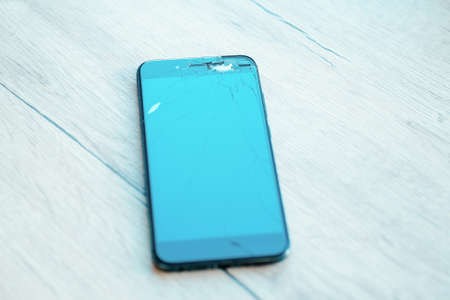 close up. cracked, damaged, broken smartphone LCD screenの写真素材