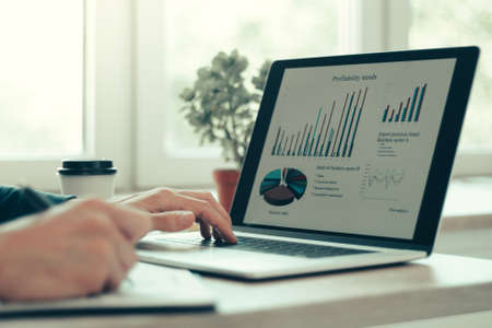 close up. business man works analyzing financial tables .