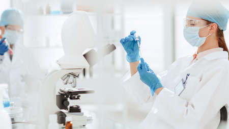 close up. scientist is conducting research on a new vaccine.
