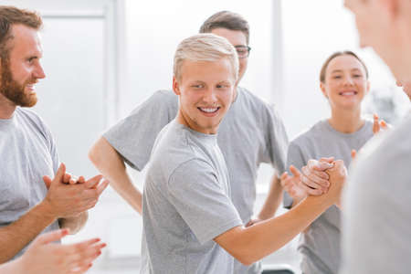 group of happy students applauding the contestants
