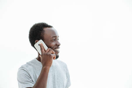 handsome guy with smartphone looking at copy space.の写真素材