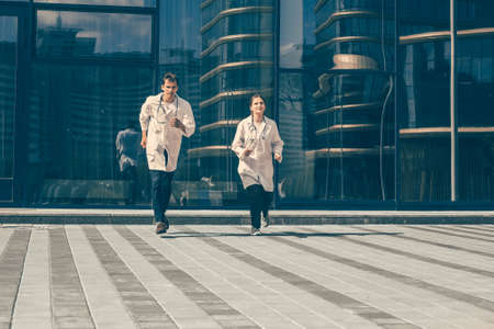 in full growth. medical professionals running to the rescue.の写真素材