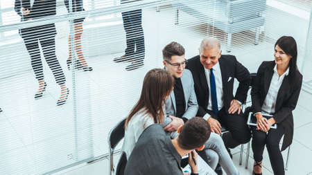group of business people discussing financial documents.