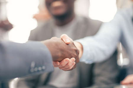 close up. handshake of business people on a blurry background.の写真素材