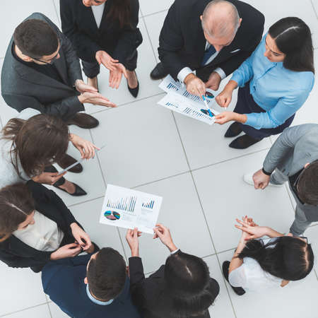 top view. group of corporate employees standing in a circle.の写真素材