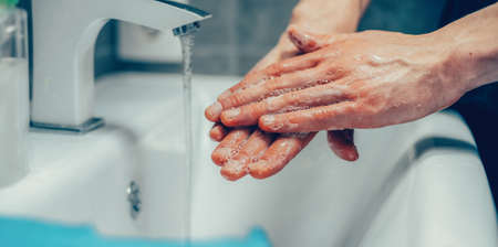 close-up. person carefully soaping the palms of his hands .