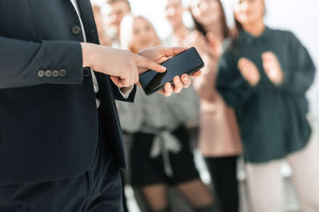 business man choosing contact on his smartphone