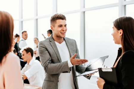 employees discuss new ideas standing in the office