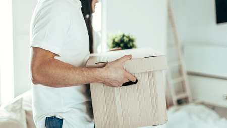 close up. a young couple with boxes in a new apartment.