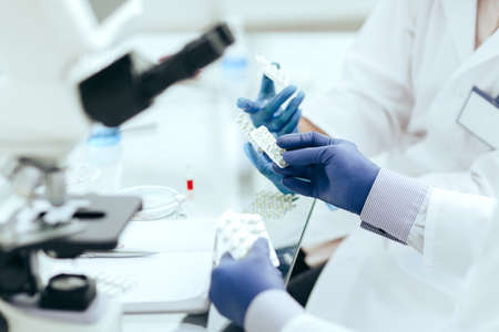 close up. doctors and pharmacist discussing a new drug .の写真素材