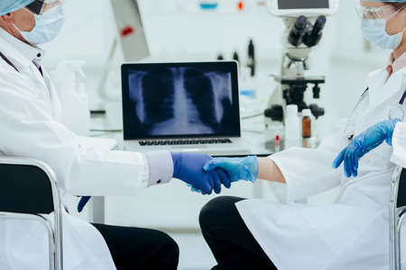 close up. medical colleagues shaking hands with each other .の写真素材