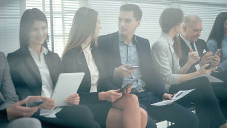 group of candidates filling out an interview form.