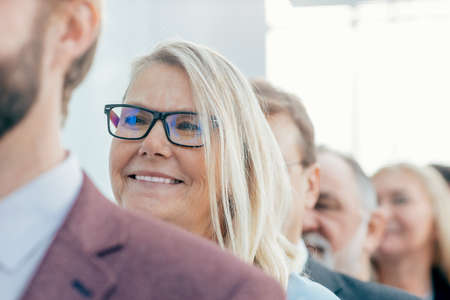 close up. smiling business people standing in a row.