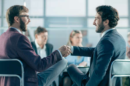close up. business colleagues shaking hands with each other.の写真素材