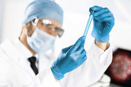 close up. sample of the vaccine in the hands of a scientist .