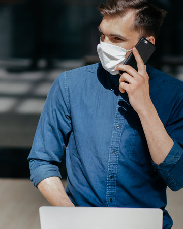 close up. young man talking on a mobile phone.の写真素材