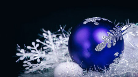 blue Christmas ball on a black background.Christmas cardの写真素材