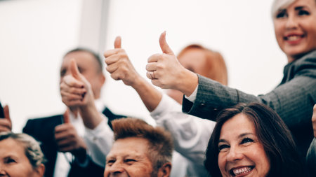 close up. image of business people showing thumbs upの写真素材