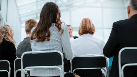 rear view. business seminar participants sitting in the conference roomの写真素材